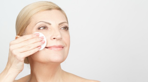 woman removing makeup