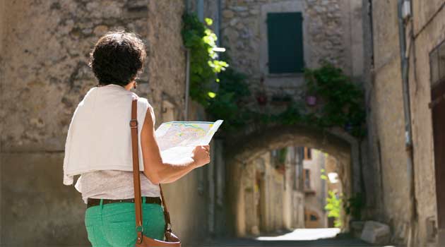 older woman holding a map