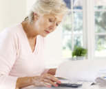 A woman looking at documents at a table