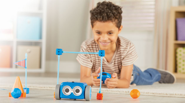 Boy playing with Learning Resources toys