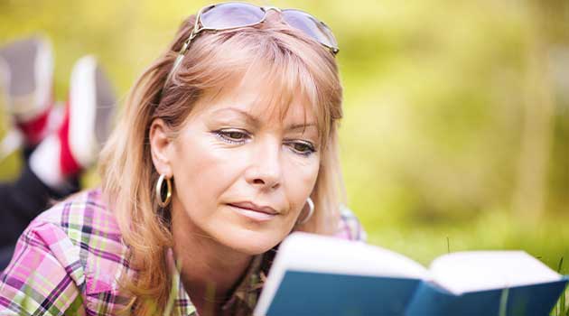 woman reading outside