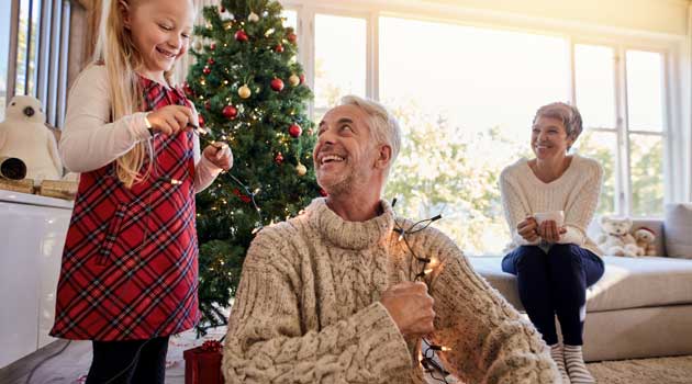 grandparents and grandchild at Christmas