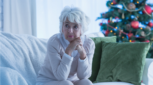 woman sitting alone at Christmas