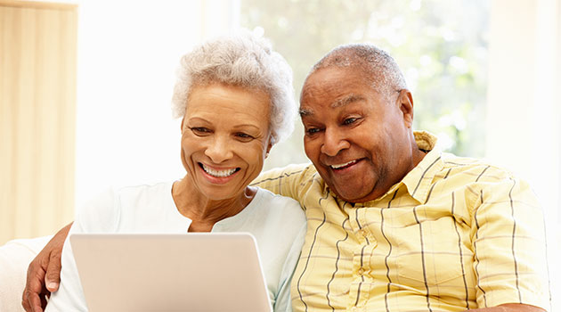 senior couple with laptop