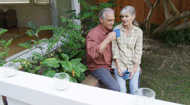 Couple in garden after downsizing