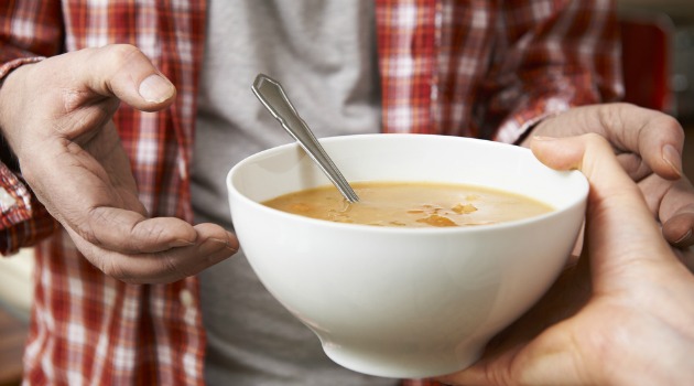 man getting soup