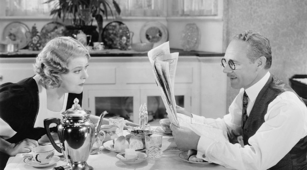 couple reading newspaper