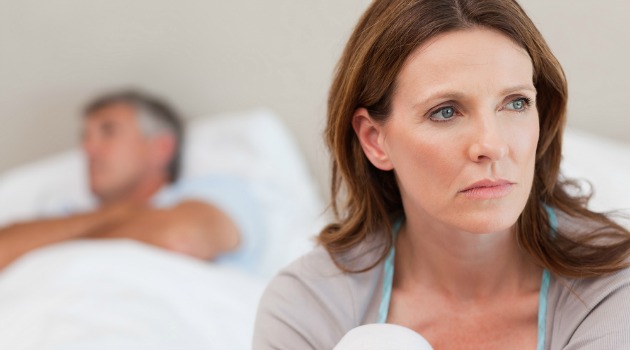 unhappy woman on bed