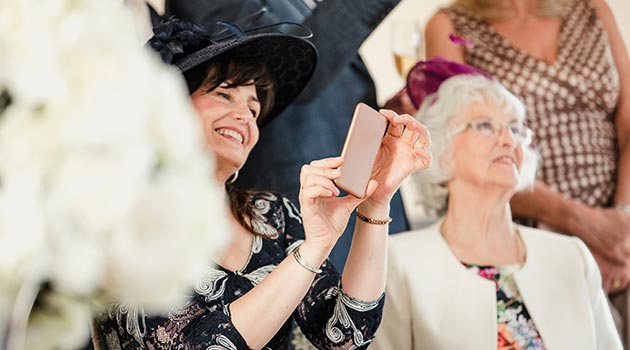 mother of the groom taking pics