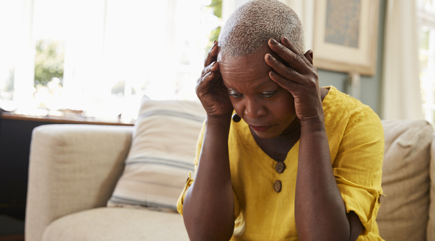 senior woman head in hands