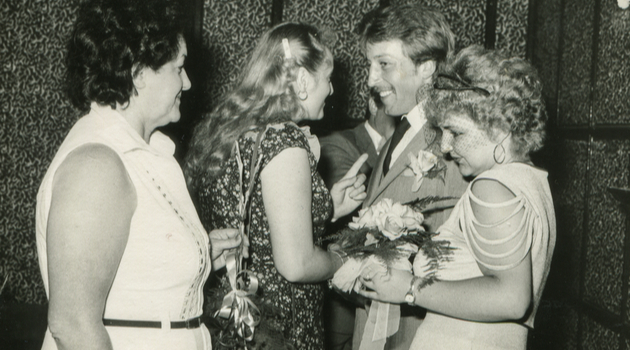 vintage newlyweds talking to guests
