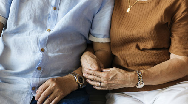 holding hands senior couple