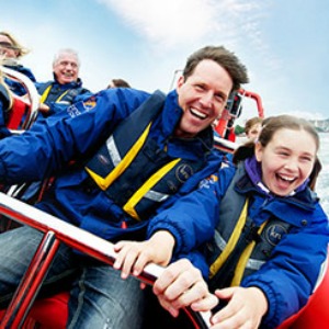 man and girl on powerboat