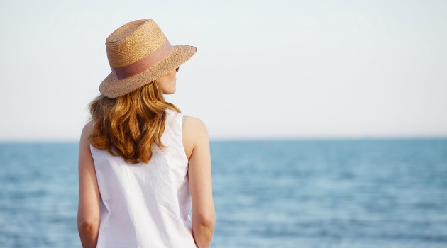 mature woman looking out to sea