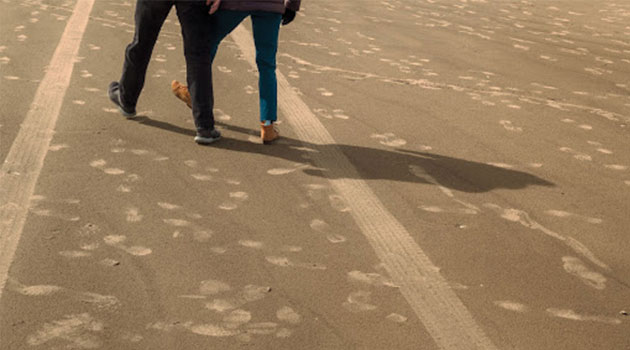 Couple walking on the beach
