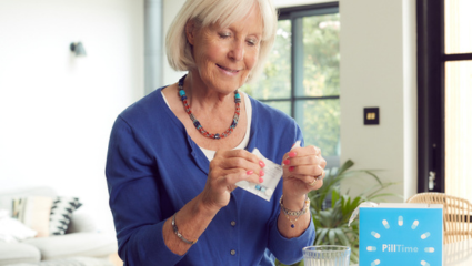 Woman opening medication